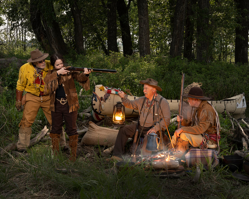 Fur Trappers teach girl how to shoot vintage rifle.